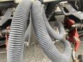 Close-up of rubber hoses attached to the hydraulic system of a 2011 Toro Reelmaster 3100-D turf management machine