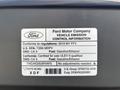2013 Ford E-350 Super Duty with a vehicle emission control information label demonstrating specifications and compliance details