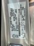 Label on a 2014 Ford Escape displaying vehicle specifications and identification details