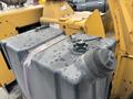 A large black fuel tank with a cap and a gauge on top secured by a strap, part of a 2015 Vermeer Corporation BC1200XL machine