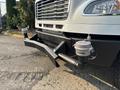 A 2016 Freightliner M2 106 truck with a prominent front bumper and two silver fittings attached to the front of the chassis