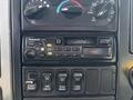 The image shows the dashboard controls of a 2006 International 4300 featuring a Panasonic audio system and several button controls for various functions