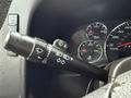 A close-up of the control stalk of a 2021 Chevrolet Express showing various functions including wipers and turn signal indicators