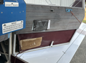 A 1986 Sorrell Hiperbipe SNS-7 Amateur-Built Aircraft with a blue and gray panel displaying a notice and a small black pouch attached to the side with a red latch