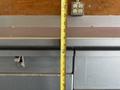 A Workhorse W62 truck with a long measuring tape placed vertically against its surface