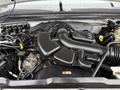 Engine compartment of a 2008 Ford F-250 SD featuring various components such as hoses and a black intake manifold