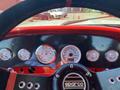 Dashboard view of a 1962 Ford 2WHDR featuring vintage-style gauges and steering wheel with Sparco logo