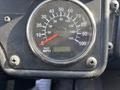 Speedometer display of a 2011 Autocar Xpeditor showing a reading of 35946.4 kilometers with dials for kilometers per hour and miles per hour