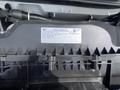 A black vehicle emission control information label attached to a component of a 2022 GMC Savana