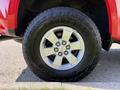 Close-up of a 2018 GMC Canyon wheel showcasing a silver rim and Goodyear tire with a rugged design