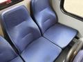 A set of blue patterned bench seats designed for a Chevrolet Express van