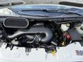 The image shows the engine bay of a 2016 Ford Transit with visible components such as the air intake hose battery and various hoses and fluids