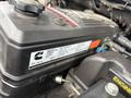 Engine compartment of a 2006 Dodge Ram 2500 featuring the Cummins turbo diesel engine with a focus on the engine cover and labels
