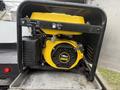A yellow and black generator with a 196cc engine mounted in a metal frame