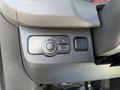 Close-up of the control panel in a 2021 Mercedes-Benz Sprinter featuring buttons for auto lighting and other vehicle functions
