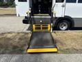 A wheelchair accessible ramp of a 2020 Chevrolet Express van featuring a textured surface and yellow edges for visibility