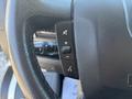 Close-up of the steering wheel controls for a 2020 RAM ProMaster 3500 featuring buttons for volume and audio settings