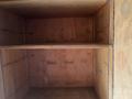Interior view of a 2012 Workhorse W62 box truck showcasing empty wooden shelves with a light brown finish