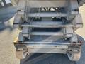 2010 Skyjack SJ scissor lift with a metal frame hydraulic lift system and four large wheels at the base