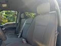Interior of a 2019 Ford F-550 featuring cloth seats with a simple design and seatbelts visible on the passenger side