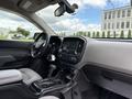 Interior view of a 2017 Chevrolet Colorado showing the dashboard steering wheel and control panel with a touchscreen display and seating area