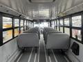 Interior of a 2007 Freightliner B2 school bus featuring gray seats arranged in rows with aisle in the center