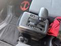 Gear shift lever of a 2012 Hino 338 with positions marked for reverse neutral and drive