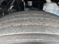 A close-up view of a tire from a 2025 Peterbilt 536 showing tread patterns and wear indicators on the rubber surface