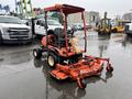 A 2012 Kubota F3680 tractor with a red body and attached mower deck in the foreground