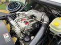 Engine compartment of a 2005 Freightliner M2 106 featuring a Mercedes-Benz engine with various hoses and components clearly visible