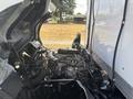 A 2018 Hino 195 truck with its hood raised revealing the engine compartment featuring various mechanical components and systems