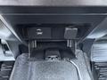 Close-up view of the dashboard console in a 2017 Ford F-550 featuring a USB port and a small compartment below