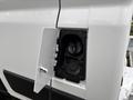 Close-up of the fuel cap area on a 2023 RAM Promaster 3500 showing the hinged cover and the fuel filler neck inside