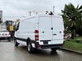 A white 2017 Mercedes-Benz Sprinter van with a clear rear view showing its large cargo area and distinctive logo