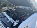 A 2017 Chevrolet Colorado engine with an open hood showcasing various components including the air intake and cooling system