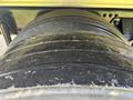 Close-up of a tire on a 2022 Freightliner M2 106 showcasing deep treads and a textured surface