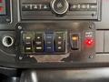 Control panel of a 2020 Chevrolet Express featuring buttons for doors interior lights and ramp operation with indicator lights and a shift lock switch