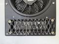 A black ventilation grill with a fan behind it showing controls for power and fan settings