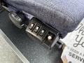 A control panel with three switches located on the side of a bus seat in a 2016 Grande West Vicinity