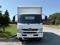 Front view of a 2020 Hino 155 box truck with a white exterior and large cargo area on top