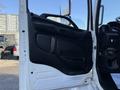 Interior door of a 2015 Hino 358 truck showing the handle speaker panel and control buttons