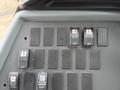 Control panel with multiple black switches labeled for various functions including stepwell heater driver heater and heated mirror