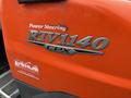 Orange 2011 Kubota RTV 1140 CPX utility vehicle with a power steering label on the side