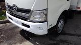 A white 2016 Hino 195 truck featuring a distinctive front grille and circular headlights with a low front bumper and the model number 195 visible on the side