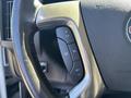 Steering wheel of a 2019 GMC Savana showing control buttons for cruise control and other functions