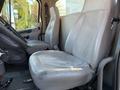 Interior of a 2011 Freightliner M2 106 featuring two gray leather seats designed for commercial use