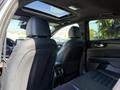 Interior view of a 2024 Kia Forte5 showing the back seats and panoramic sunroof