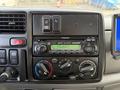 Dashboard controls of a 2008 International CityStar featuring a Panasonic stereo system with knobs for air conditioning and audio settings