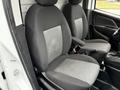 Interior view of a 2017 RAM ProMaster City showing two front seats with gray upholstery and armrests