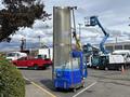 A 2023 Bitimec SC415 is a large, vertical cleaning machine with a blue base and silver cylindrical body connected to a hose for washing surfaces
